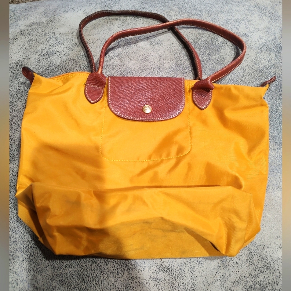 Longchamp brand mustard colored tote purse bag